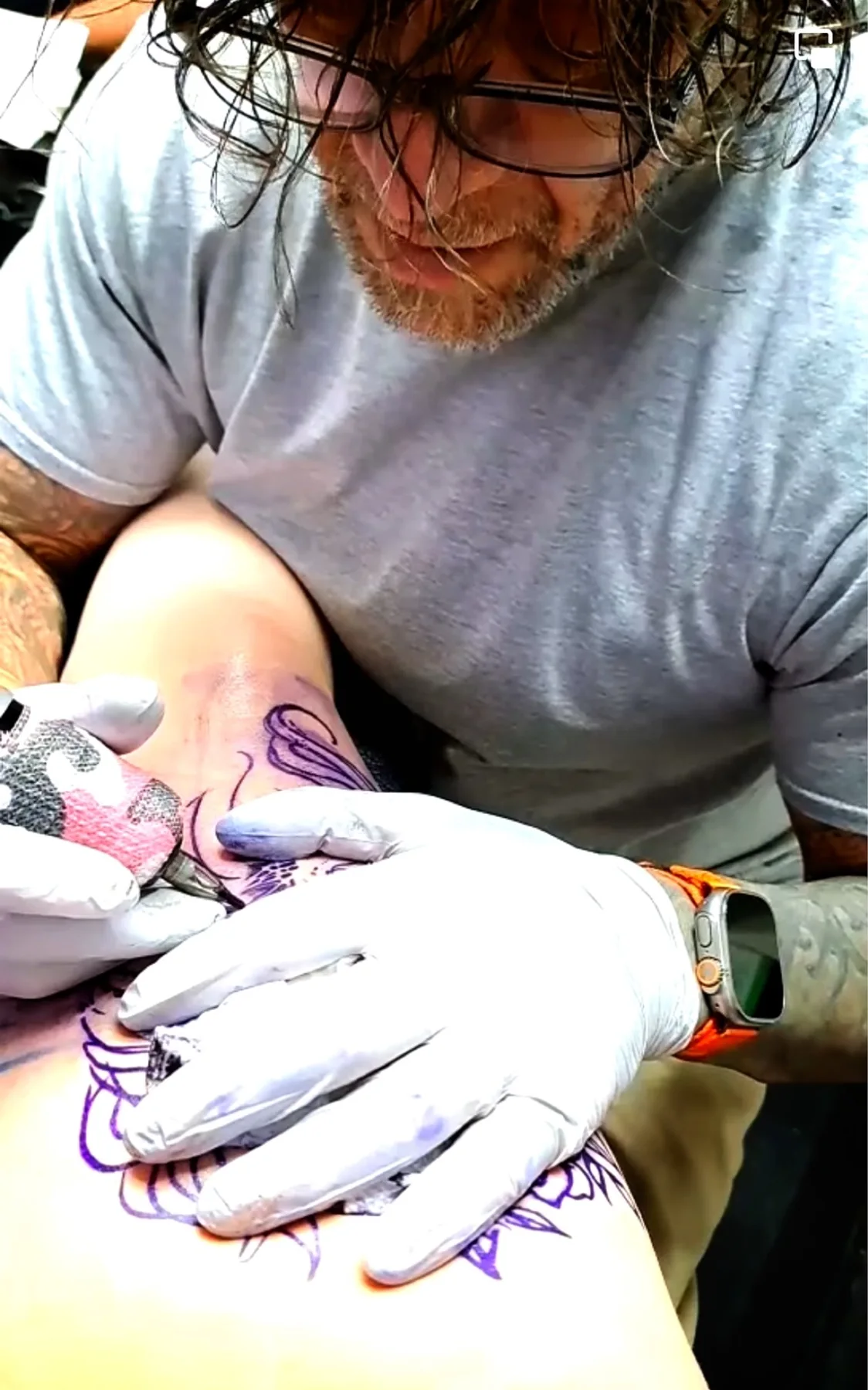Close view of an artist working on a tattoo